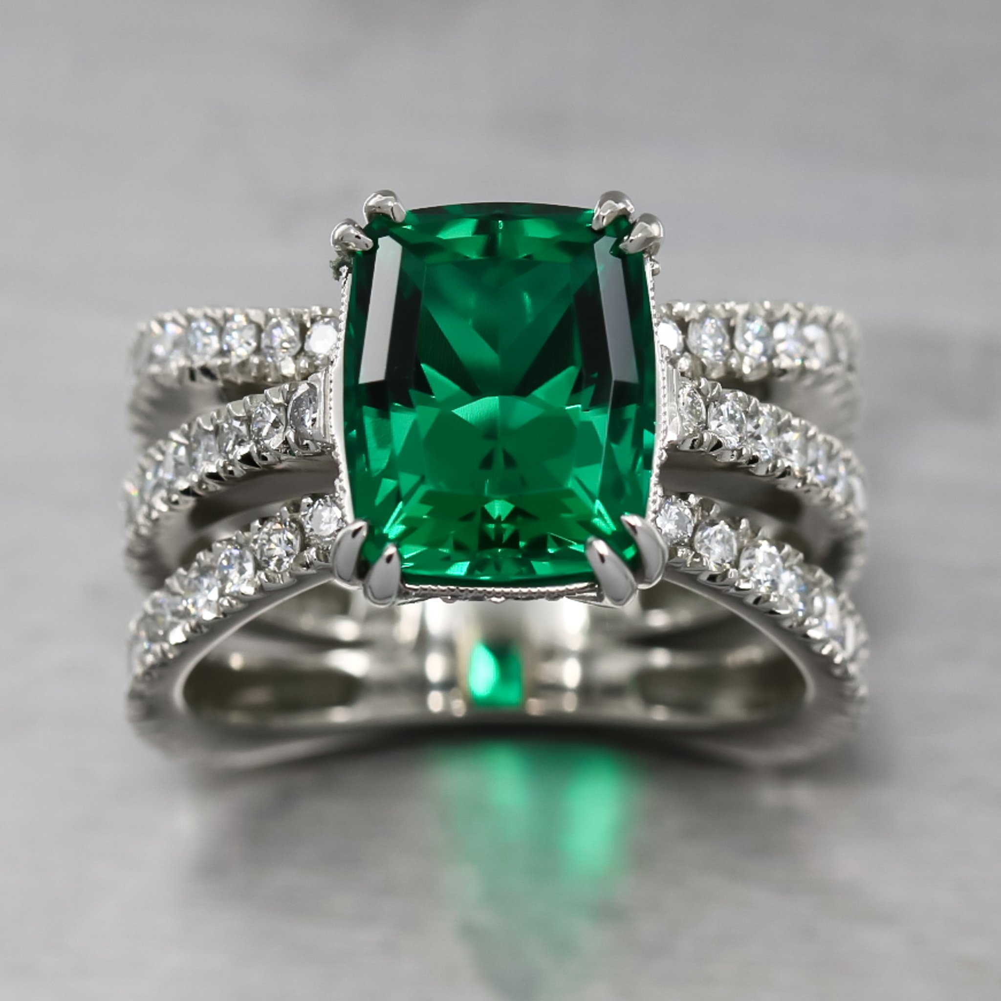 platinum-ring-lab-emerald-custom-cut-double-claw-prong-three-band-design-fishtail-set-diamond-bands-top-view.jpg