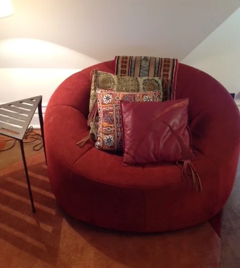 3 pillows---18" x 18" found fabric with mirror & fringe, 16" x 16" found fabric with mirrors & fringe, 14" x 14" leather with fringe