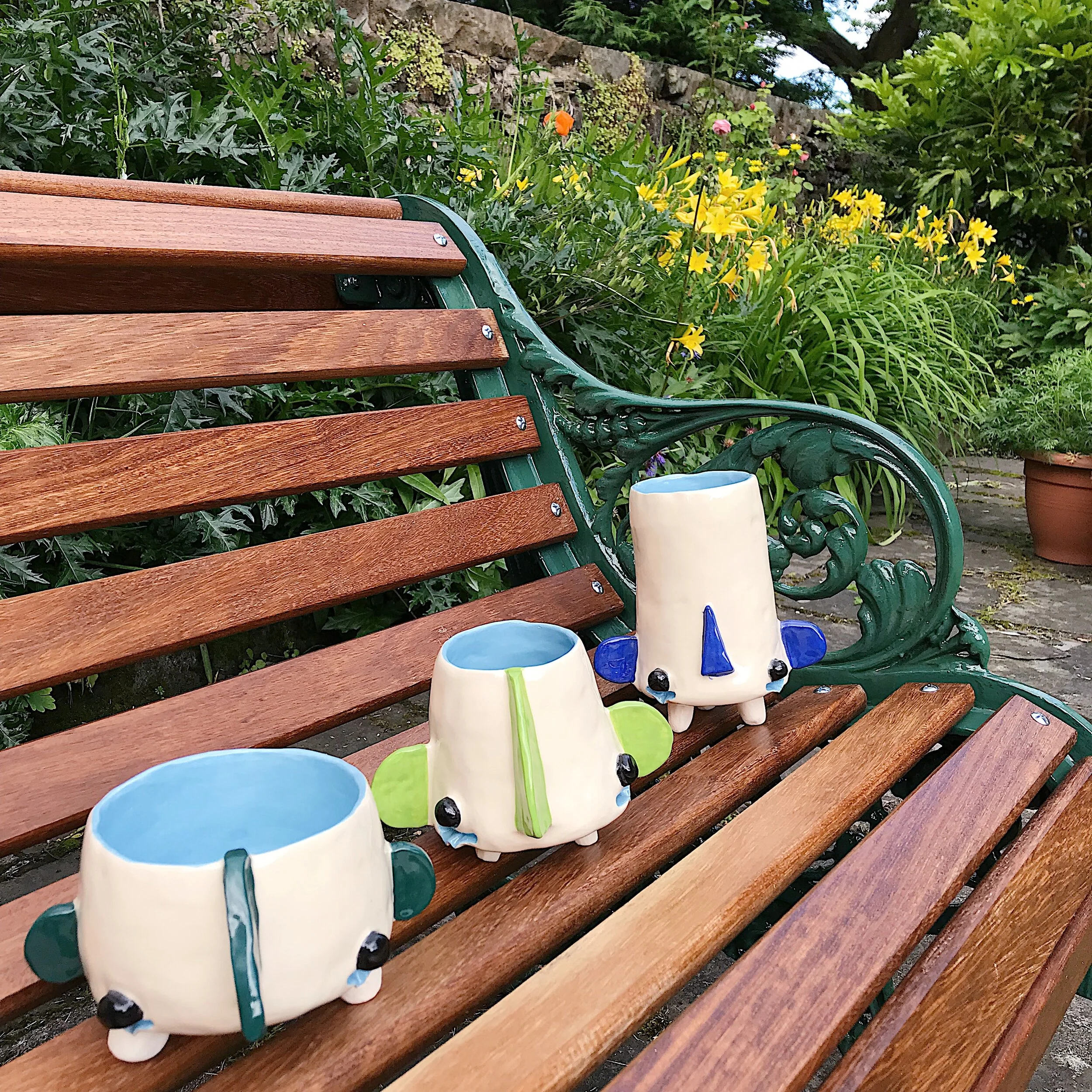  Sad little men who really really wants your flowers to thrive and be emotionally healthy!  Sometimes you just have to let it out.      These pots have functional tear ducts.  When vase is over-filled water will leak out underneath the eye details an