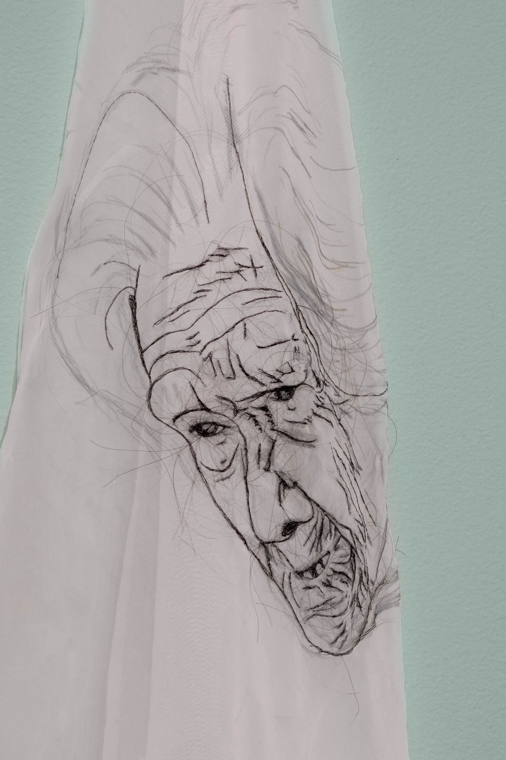   yo seré tu memoria (I will be your memory)   2022  the artist’s hair embroidered on fabric plus installation elements (paint, faux pearls, faux flowers, glass milk vase)  24 x 36 inches 