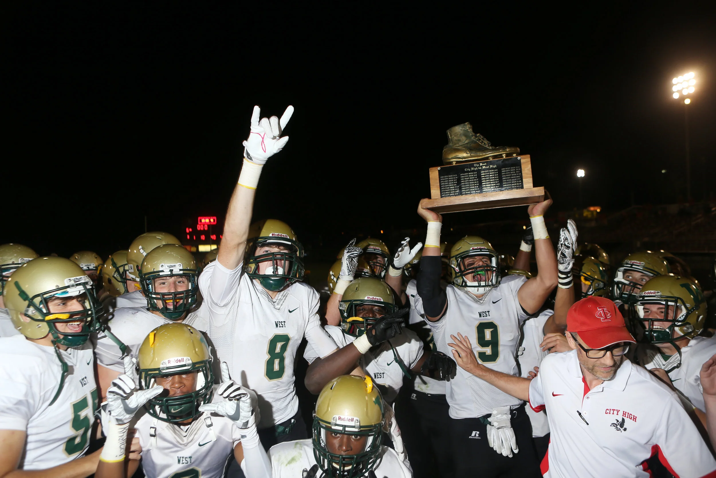  Iowa City West’s Dillon Doyle (9) lifts the Boot trophy while celebrating with teammates after a Class 4A varsity high school football game against cross-town rival Iowa City High, Friday, Sept. 15, 2017, at Frank Bates Field in Iowa City, Iowa. 