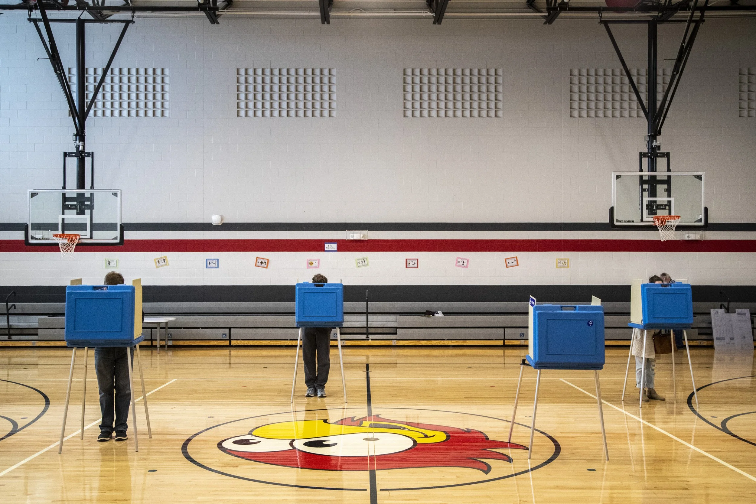  People cast their ballot in voting booths for the general election on Election Day, Tuesday, Nov. 3, 2020, at Hoover Elementary in Iowa City, Iowa. 