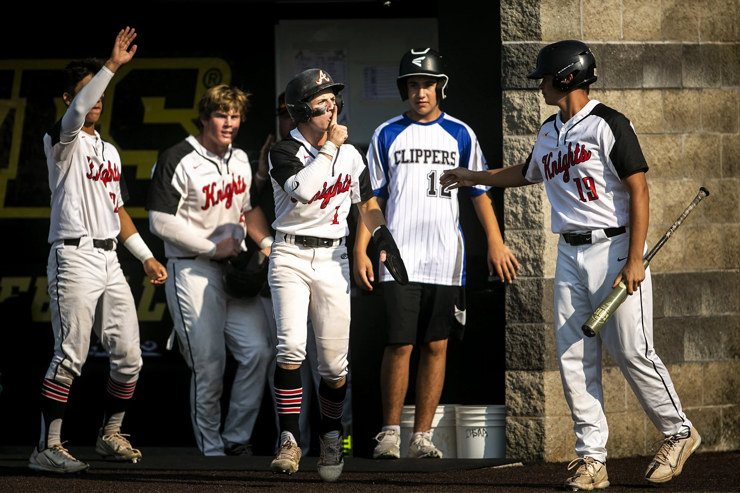  Davenport Assumption's Max Stein, third from left, reacts after scoring a run during a Class 3A high school semifinal state baseball game against Independence, Wednesday, July 20, 2022, at Duane Banks Field in Iowa City, Iowa. 