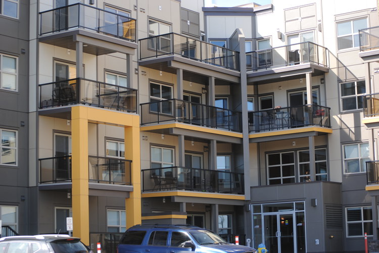 UPPER WINDERMERE CONDO COMPLEX – Hardie Lap, Hardie Trims, Drip Caps, Steel Shutters and EZ Trim all coated to highlight Alpacca (a custom General Paint colour).