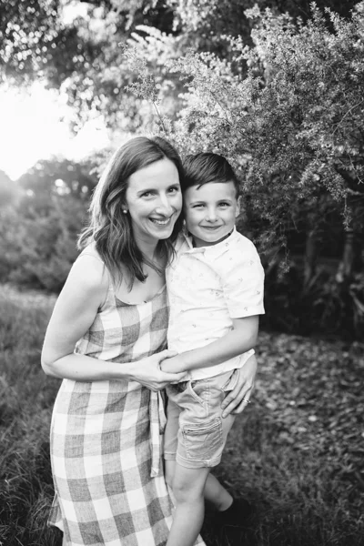Kew family photographer natural black and white mum and son motherhood sunset backlight 