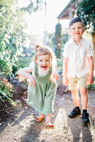 Ivanhoe East family photographer brother sister backlight natural sunset melbourne candid summer red head little girl 