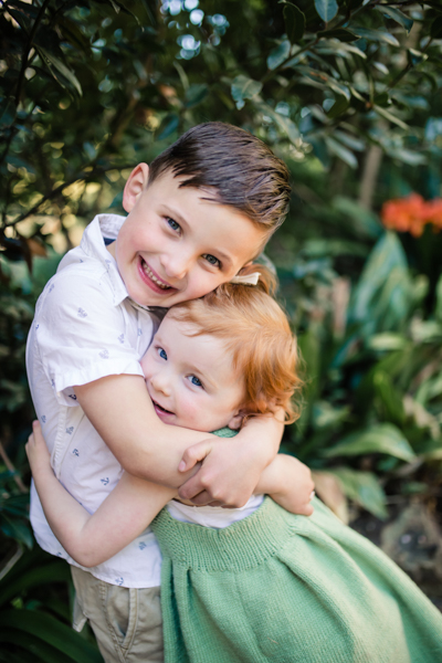 Box Hill family photographer brother sister backlight natural sunset melbourne candid summer red head little girl 