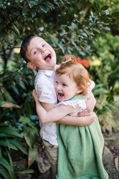 Ballarat family photographer brother sister backlight natural sunset melbourne candid summer red head little girl 