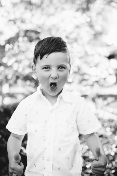 Kew family photographer brother boy backlight natural sunset melbourne candid summer black and white