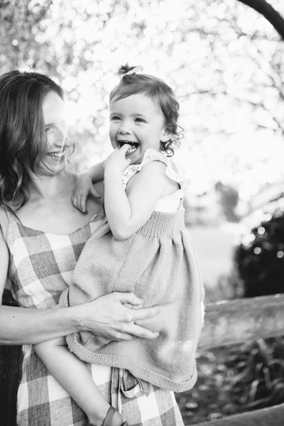 East Melbourne family photographer mother and daughter backlight natural sunset melbourne candid summer black and white