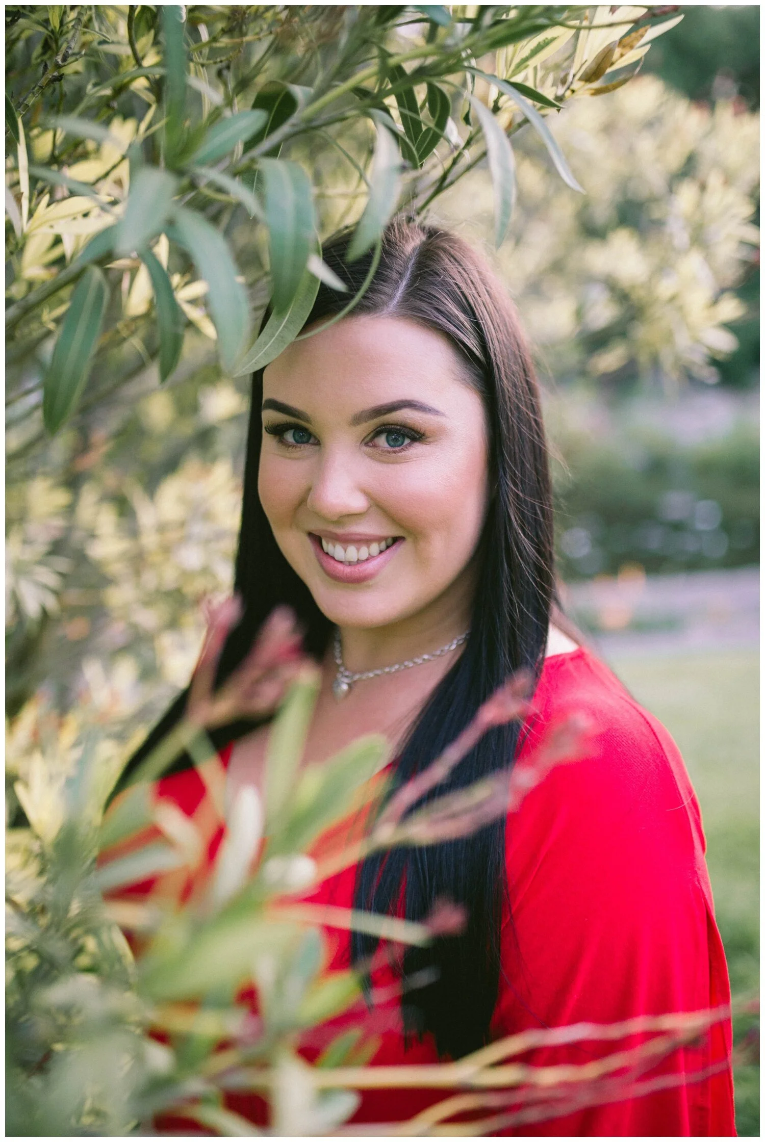 Coburg portrait photographer. Coburg Lake. Engagement Photography. Red dress. Natural light. Love. Candid. Melbourne makeup artist.