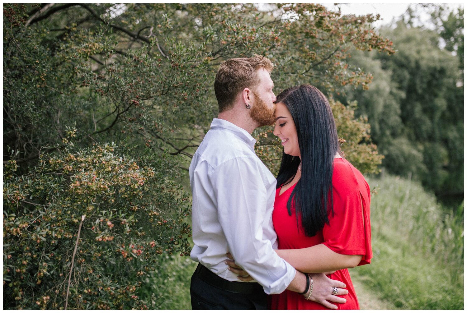 Eaglemont portrait photographer. Engagement photographer. Coburg Lake. Red dress. Natural light. Love. Candid. Red head. Melbourne makeup artist.