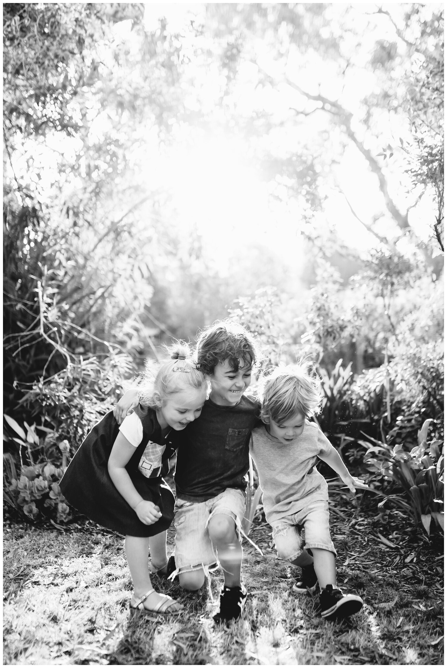 Family photographer Balwyn. Natural family photography. Siblings. Brother and sister. Backlight. Natural light. Sunset. Sunrise. Melbourne. Candid summer autumn spring garden