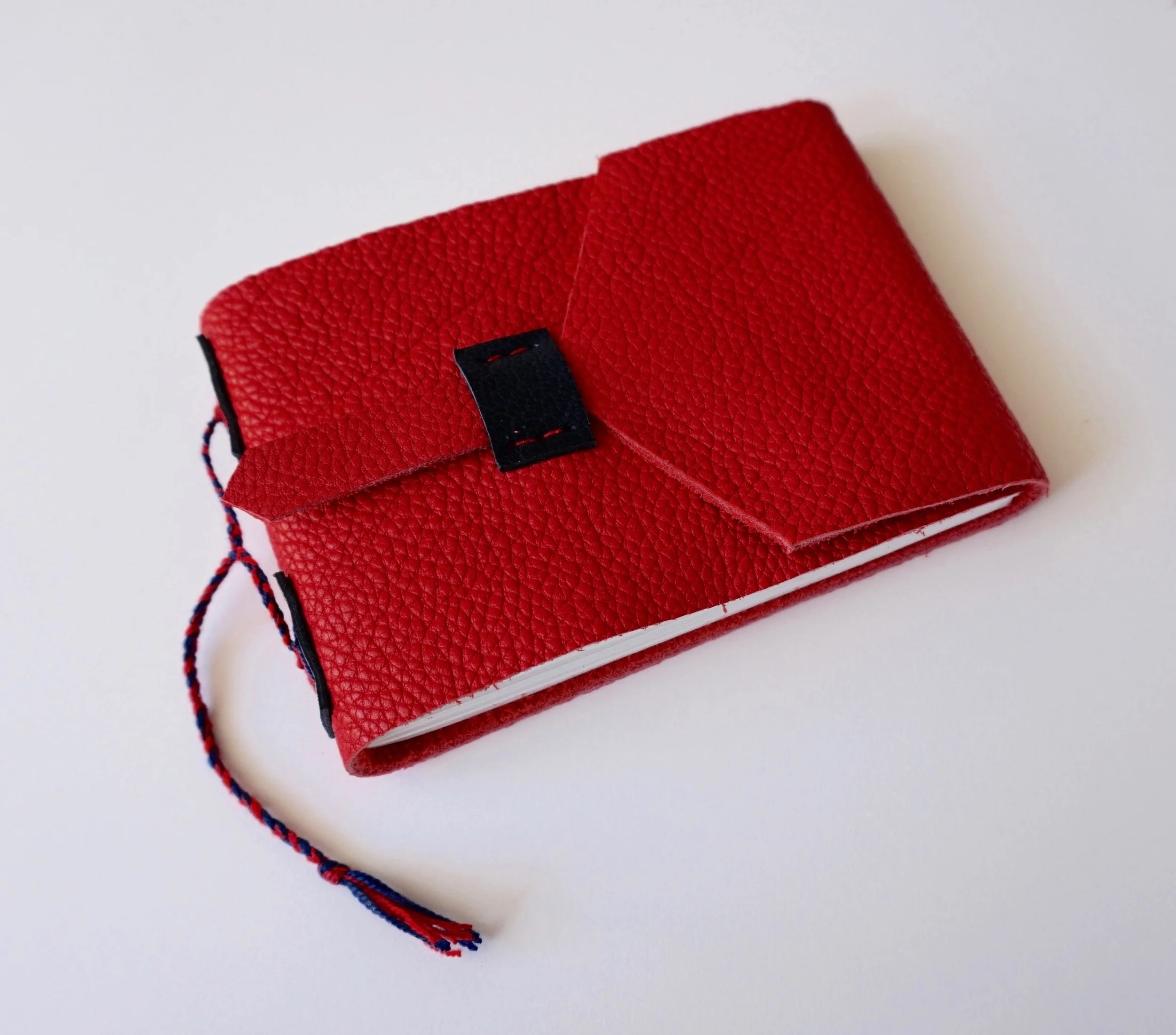 Another small pocket book with a leather cover.&nbsp;