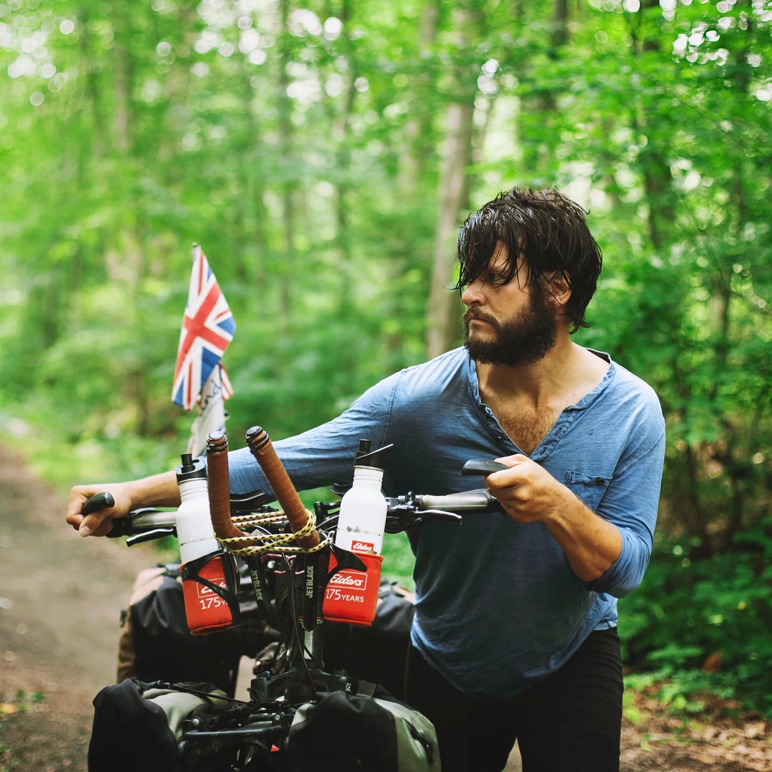 A handful of images to sum up the last four years of my life, four years spent cycling 40,000kms around the world for mental health. This is me with my bike, Sixty, a few months ago in the forests of New York, nearing the end of the journey, bearded, long haired, thin but determined, refocused, free and riding wild… I’d come a long way. 30 countries. 3 continents. Lost a bike to a car crash. Crossed the Himalayas. Opened up to the world about a lifelong struggle with OCD & depression. And, from sleeping rough on a rainy rooftop in London, depressed and alone, here I was with the world behind me, fresh air in my lungs and a thousand memories of faces and landscapes full of joy, challenges and revelations with over £5,000 raised for Mind & OCDUK.