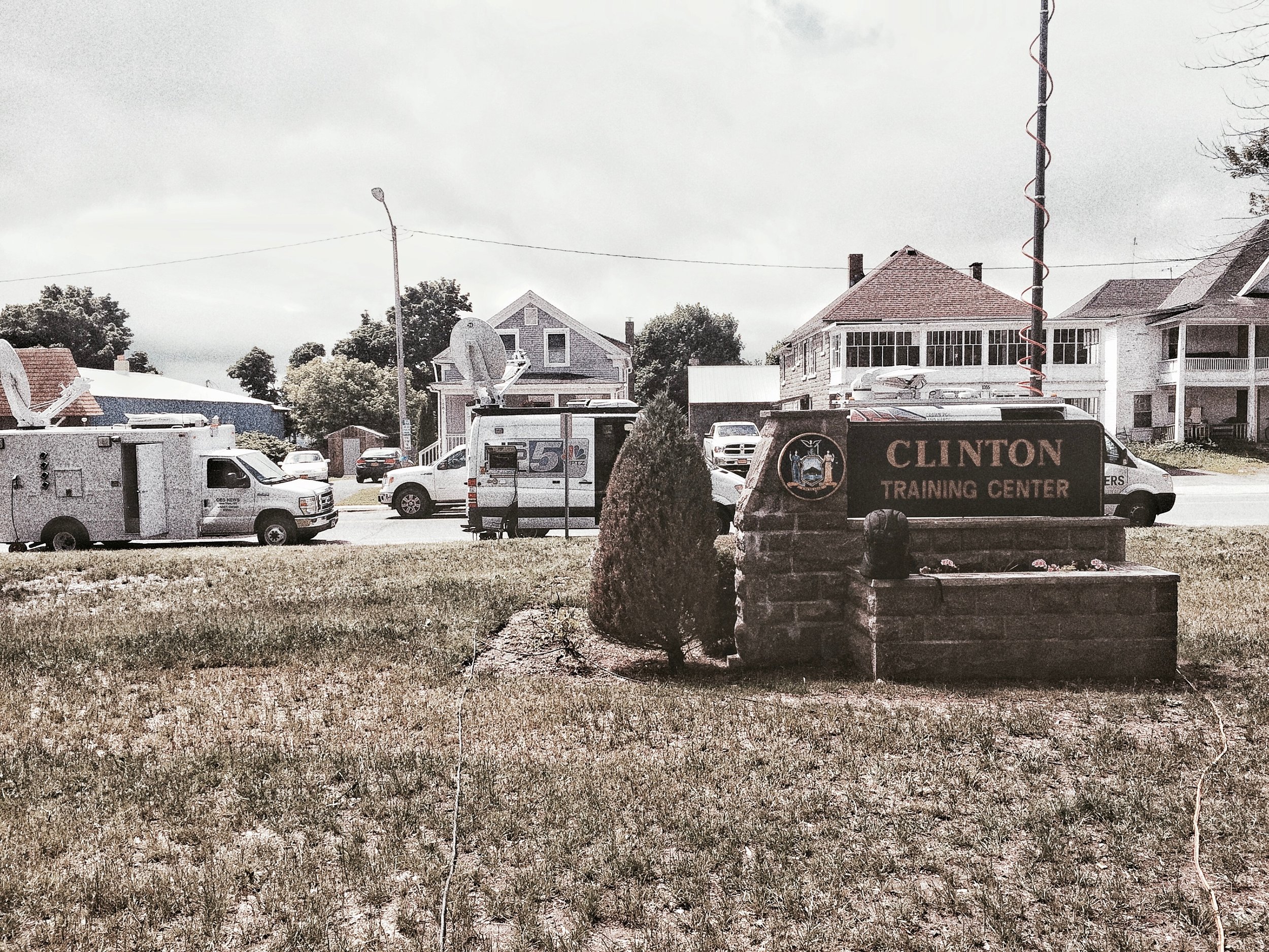  TV trucks line up in front of Clinton Correctional Facility for a press conference about the prison break.&nbsp; (Chelsia Rose Marcius/June 19, 2015)  