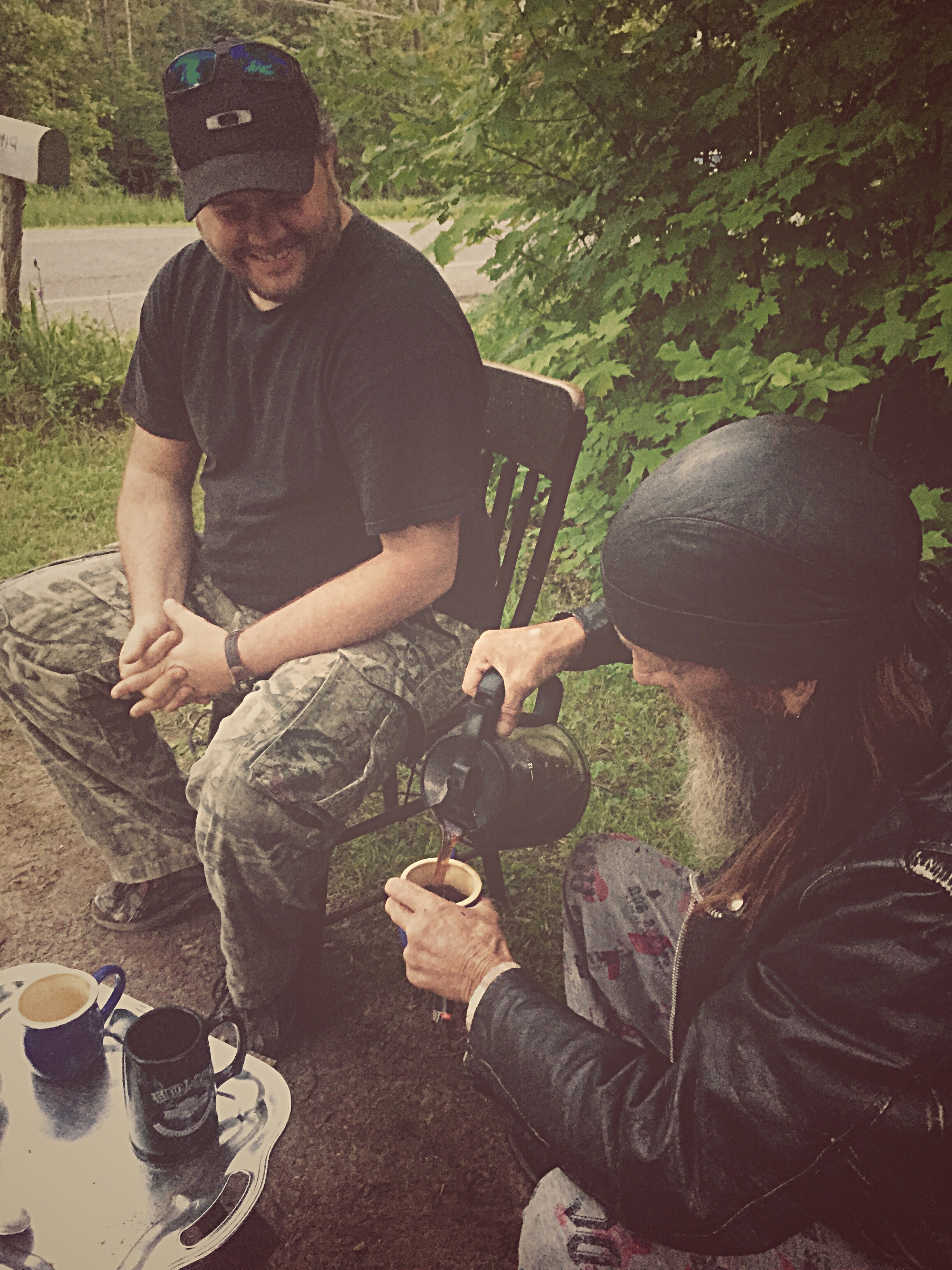 Michael McCaffrey joins "Slim" for a cup of coffee on the side of Fayetteville Road in Malone, N.Y. as state troopers descend on the area in search of David Sweat.  (Chelsia Rose Marcius/June 26, 2015)&nbsp;  