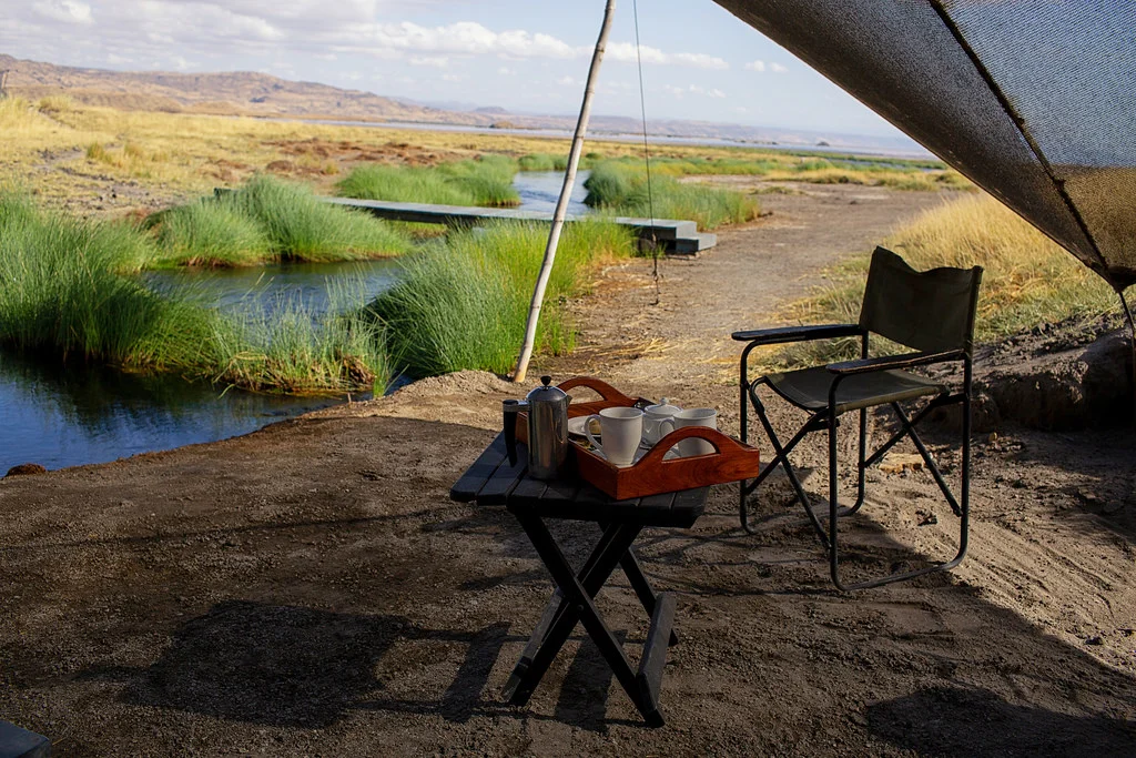 Morning coffee by the natural stream