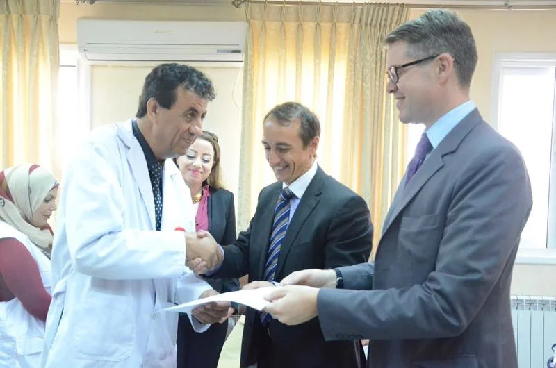 The Australian Representative to the Palestinian Authority, Mr Tom Wilson, formally hands over the Australian contribution toward equipment and supplies.