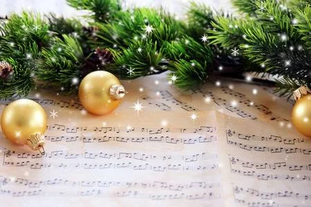 57510347-christmas-decorations-on-music-sheets-with-snow-effect.jpg