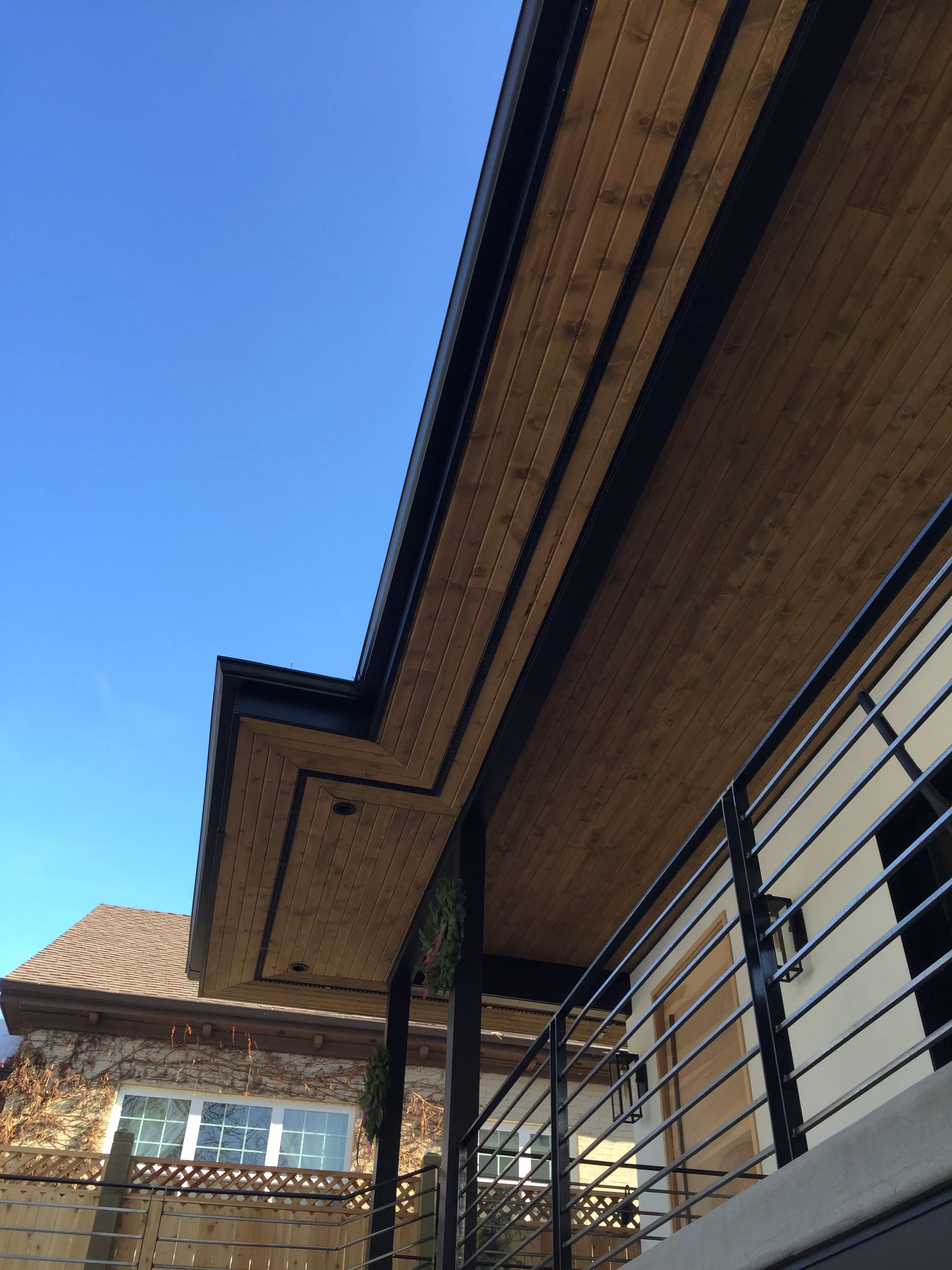 Aluminum fascia, wood tongue and groove soffit, aluminum rain gutter