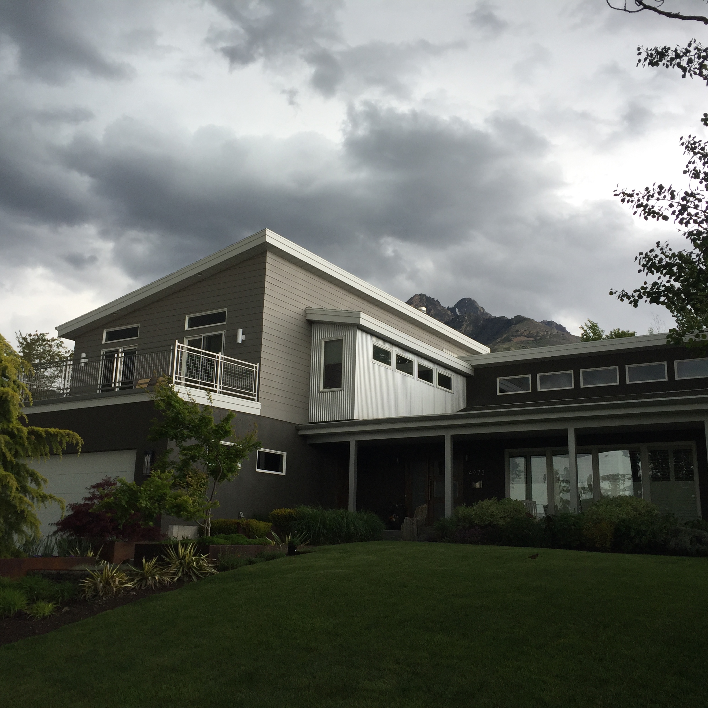 Fiber cement siding, aluminum soffit facia, corrugated metal siding, and stucco
