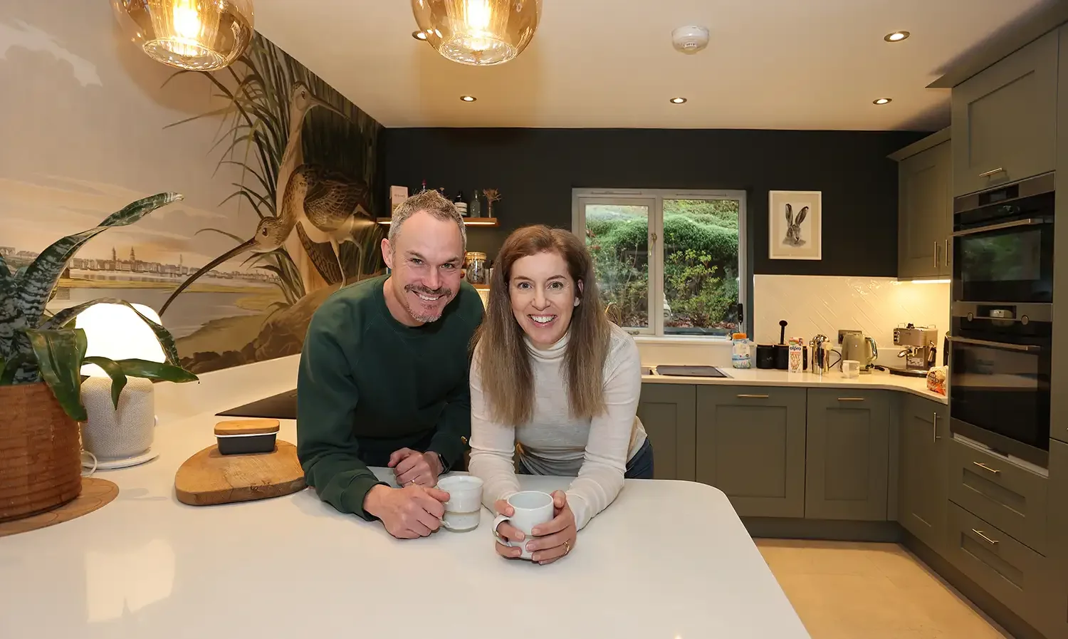 Photo of couple business owners in modern family kitchen