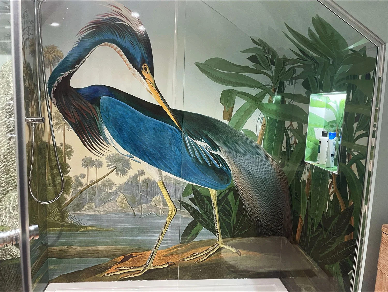 Louisiana Heron design printed shower panels wrapping around three walls of a shower enclosure in a modern bathroom. Bird print shower feature wall design.