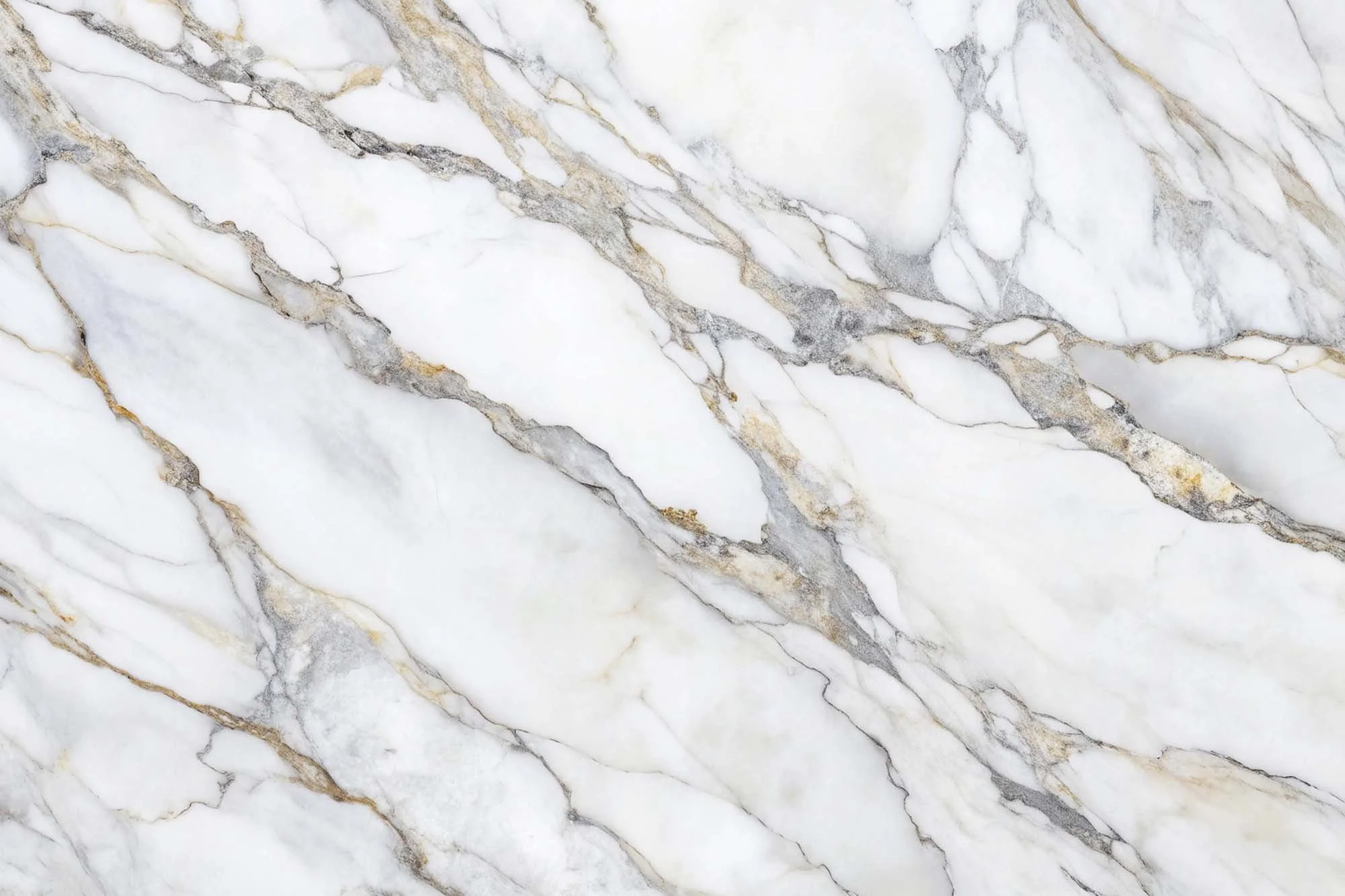 Luxurious Calacatta marble, light natural colour background with bold grey and gold toned mineral veining.