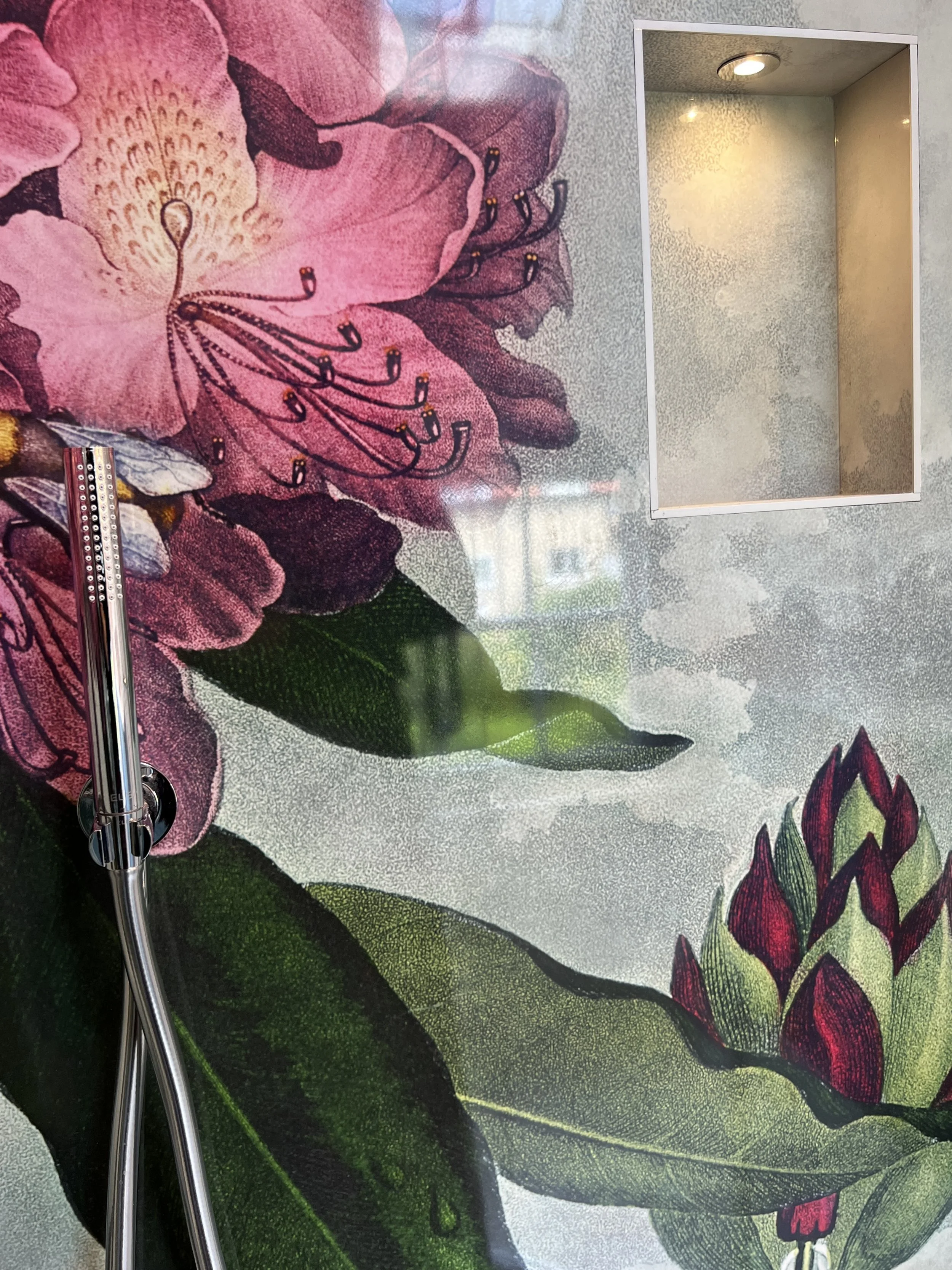 Shower inset shelf niche, with custom printed shower panel design. Grey textured art print with bold pink flower design.