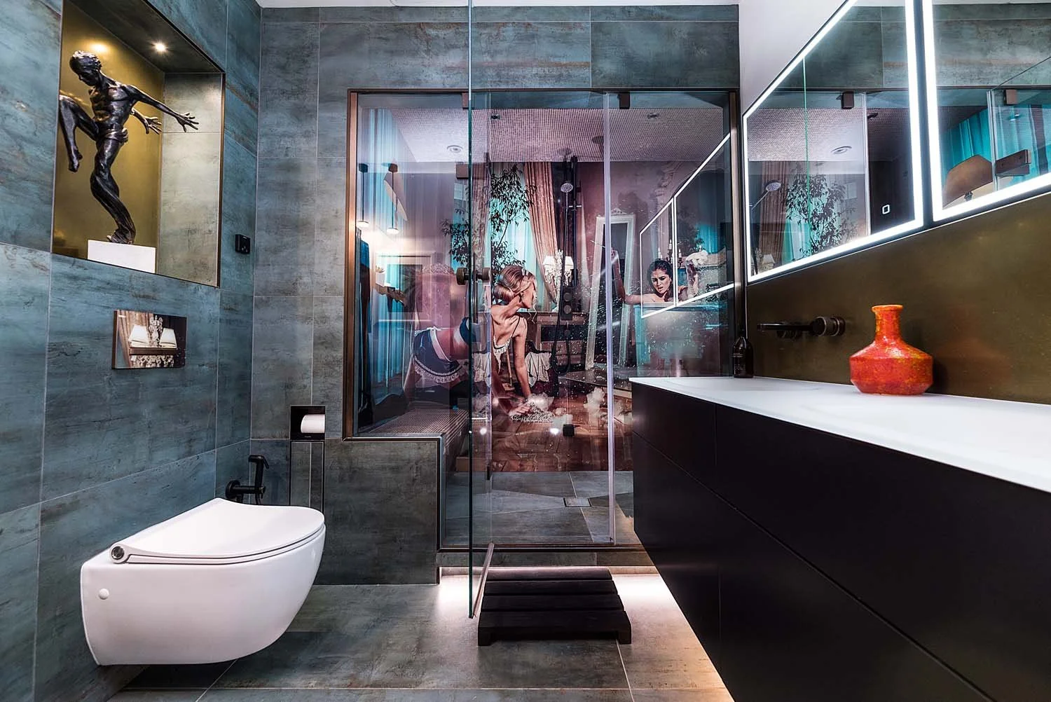 Luxurious, adult, creative bathroom design with integrated shower and steam room behind glass doors. Luxury bathroom design and fittings, artworks and lighting.