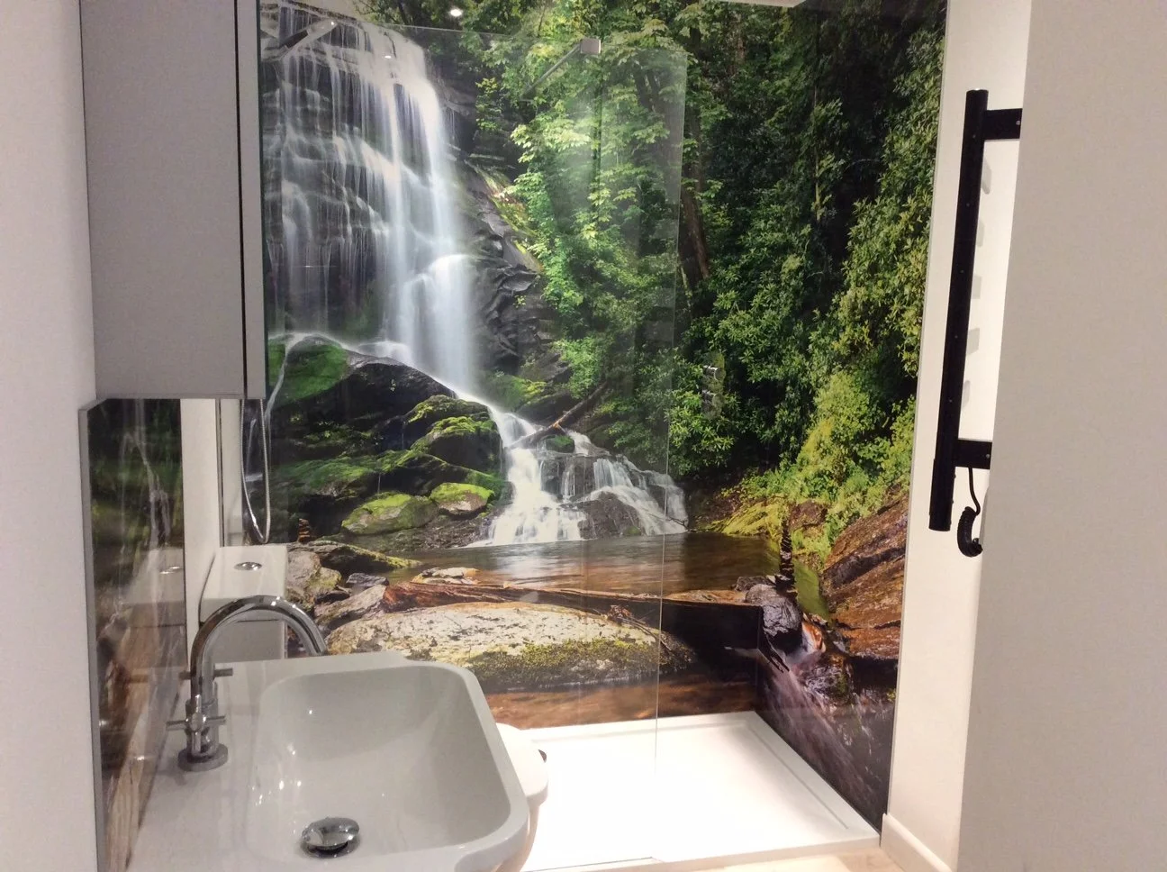 Waterfall shower wall backdrop. Shower panel feature wall in a small bathroom.