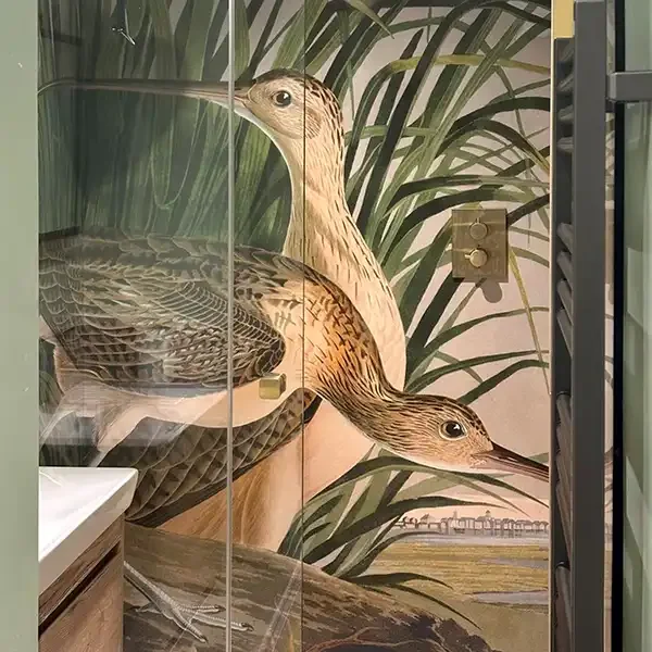 Vintage Curlew illustrated shower feature wall. Natural tones of greens and browns give a home-spa feel.