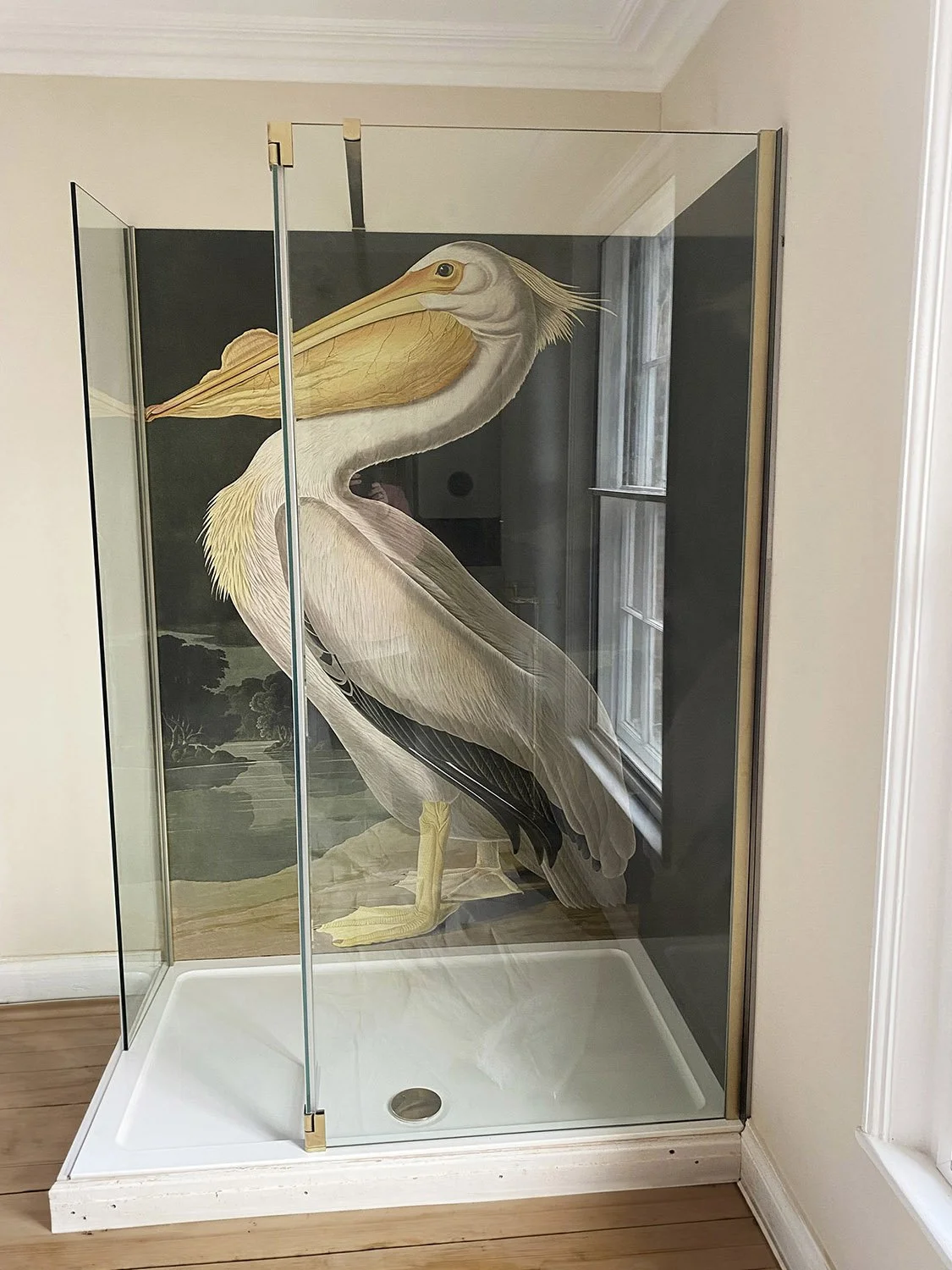 American White Pelican shower panel installed in a corner shower in an English period home. Feature wall and matching side panel in a frameless glass shower enclosure.