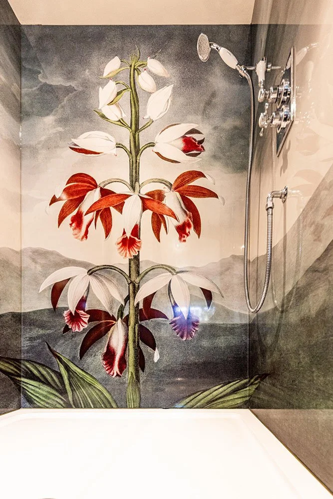 China Limodoron design shower panel installed with image wrapping around shower enclosure walls. Traditional chrome shower mixer and shower head.