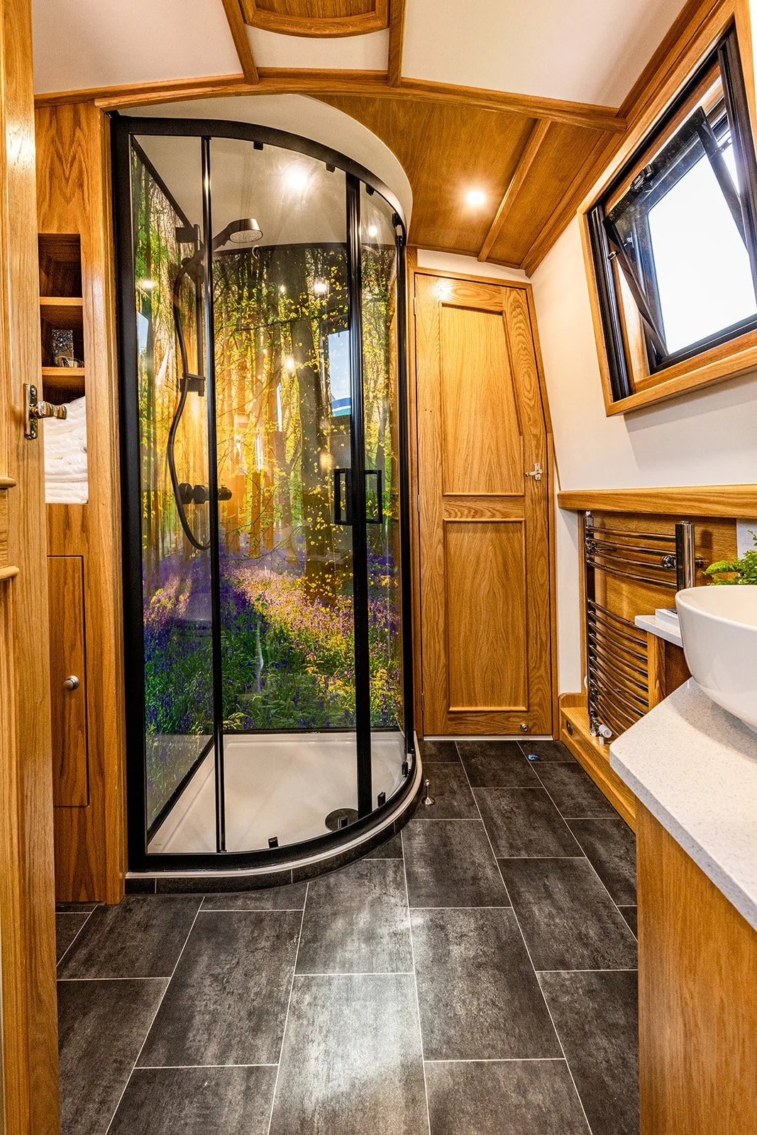 Bluebell Wood image shower panels in narrowboat bathroom - small shower cubicle with showerscape shower panels