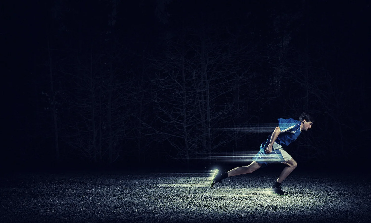 An athlete accelerating from a sprint start.