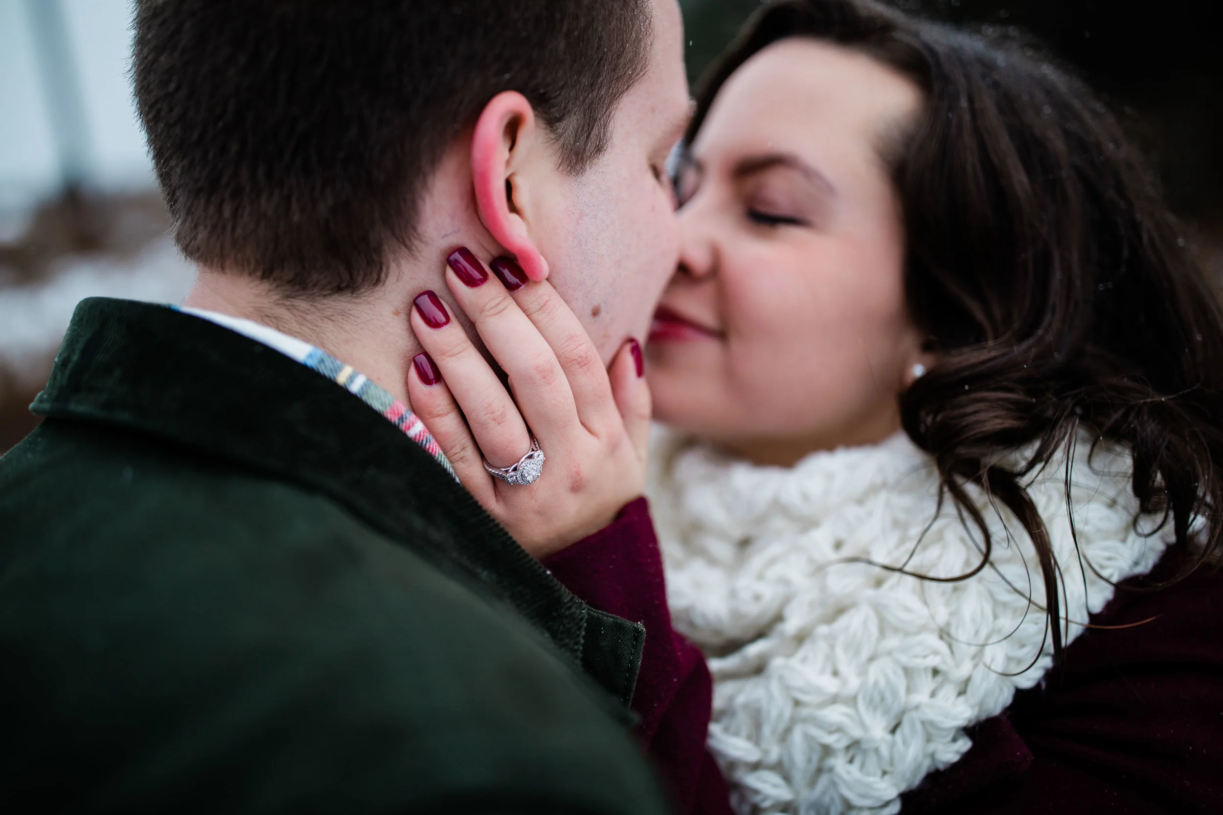 Libby and Alex kiss and show off their engagement ring.