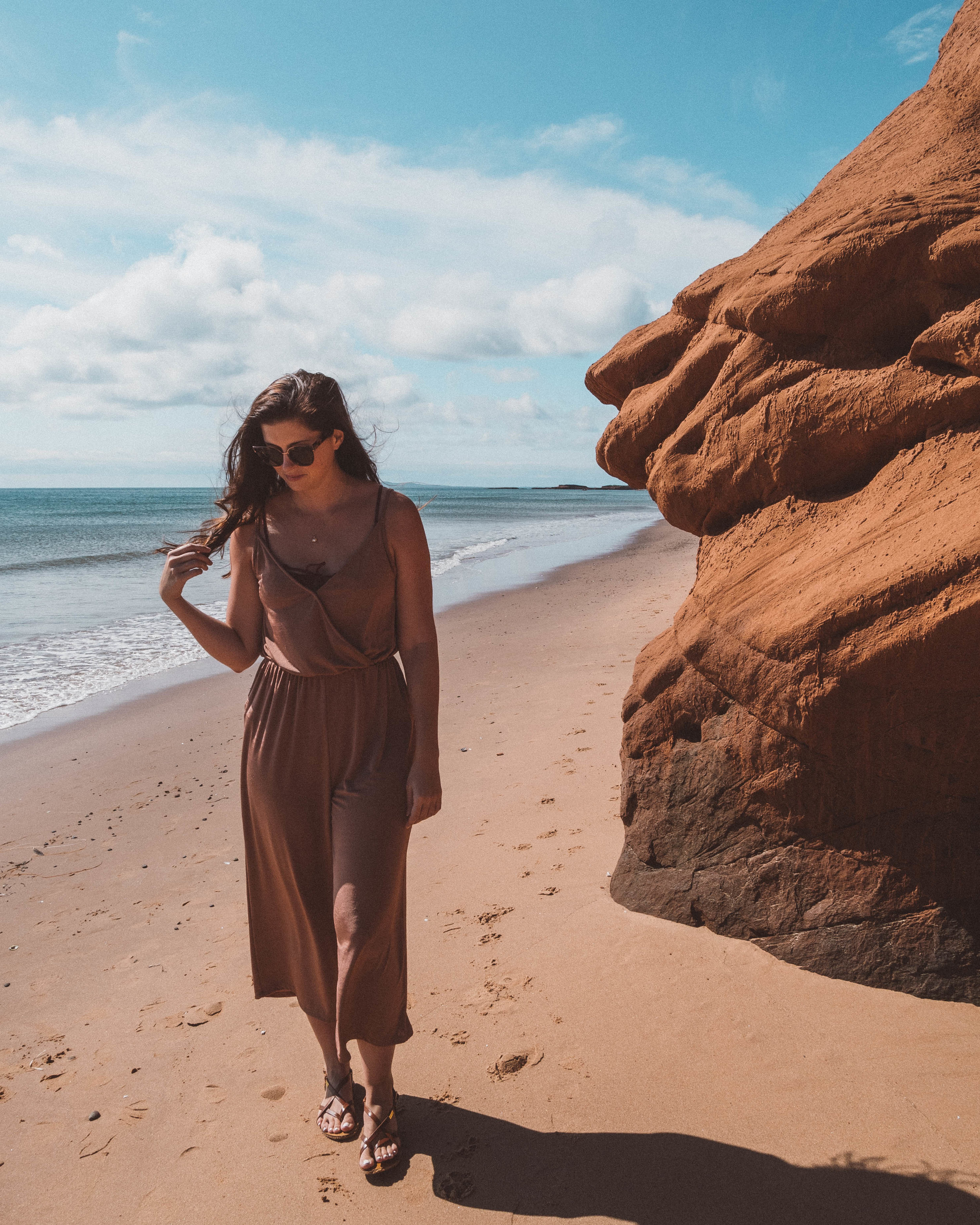 Girl walking on the beach, Gros-Cap - Magdalen Islands / Îles-de-la-Madeleine - Canada