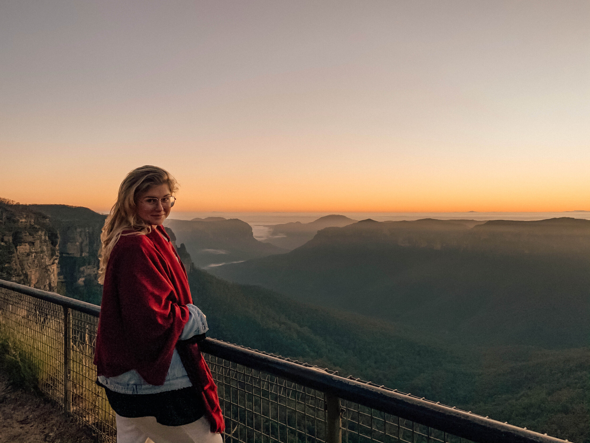 Girl watching the sunrise at Govetts Leap - Blue Mountains - New South Wales (NSW) - Australia