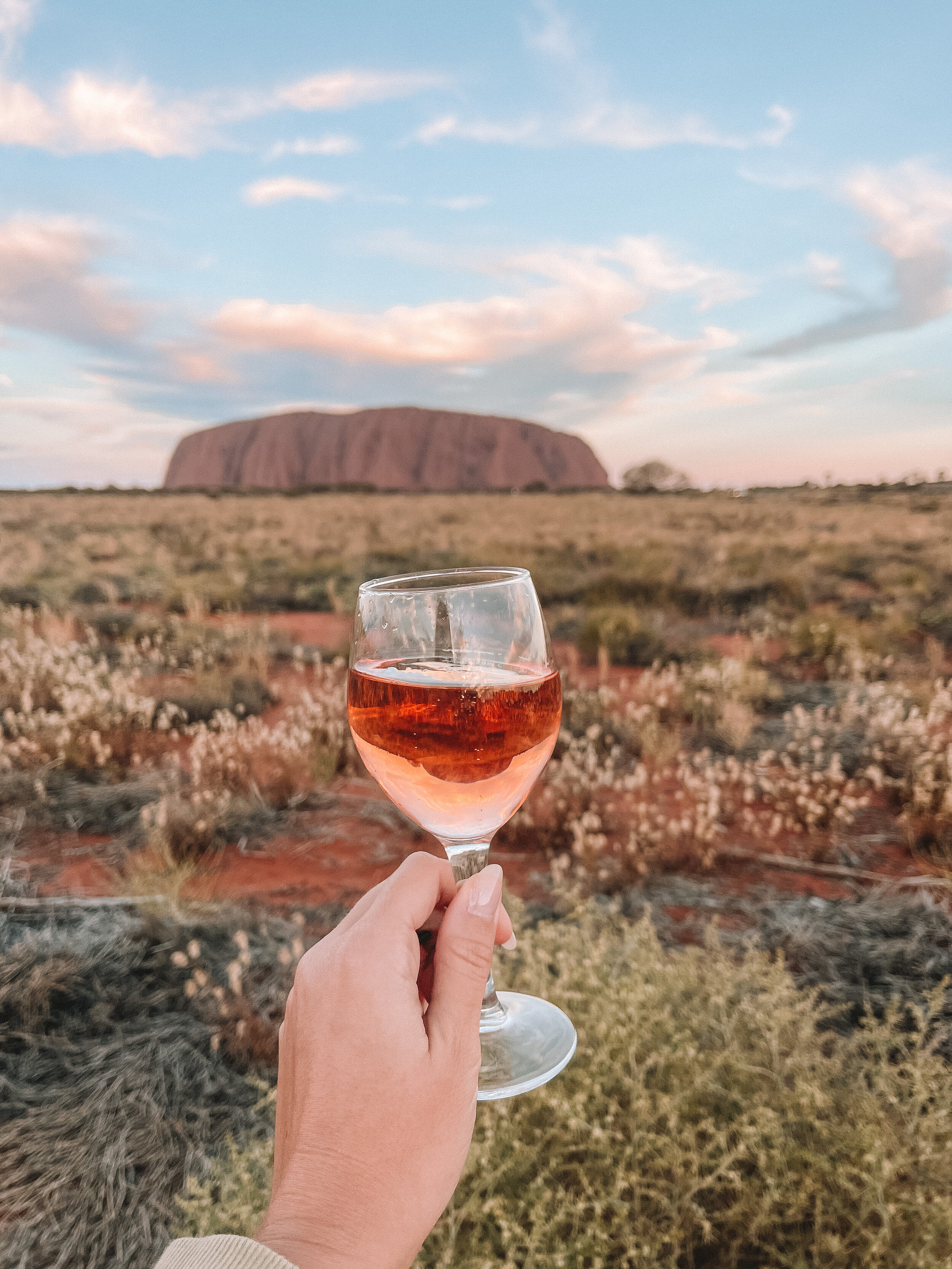 Cheers - Glass of rose - Uluru sunset viewing platform - Uluru - Northern Territory - Australia