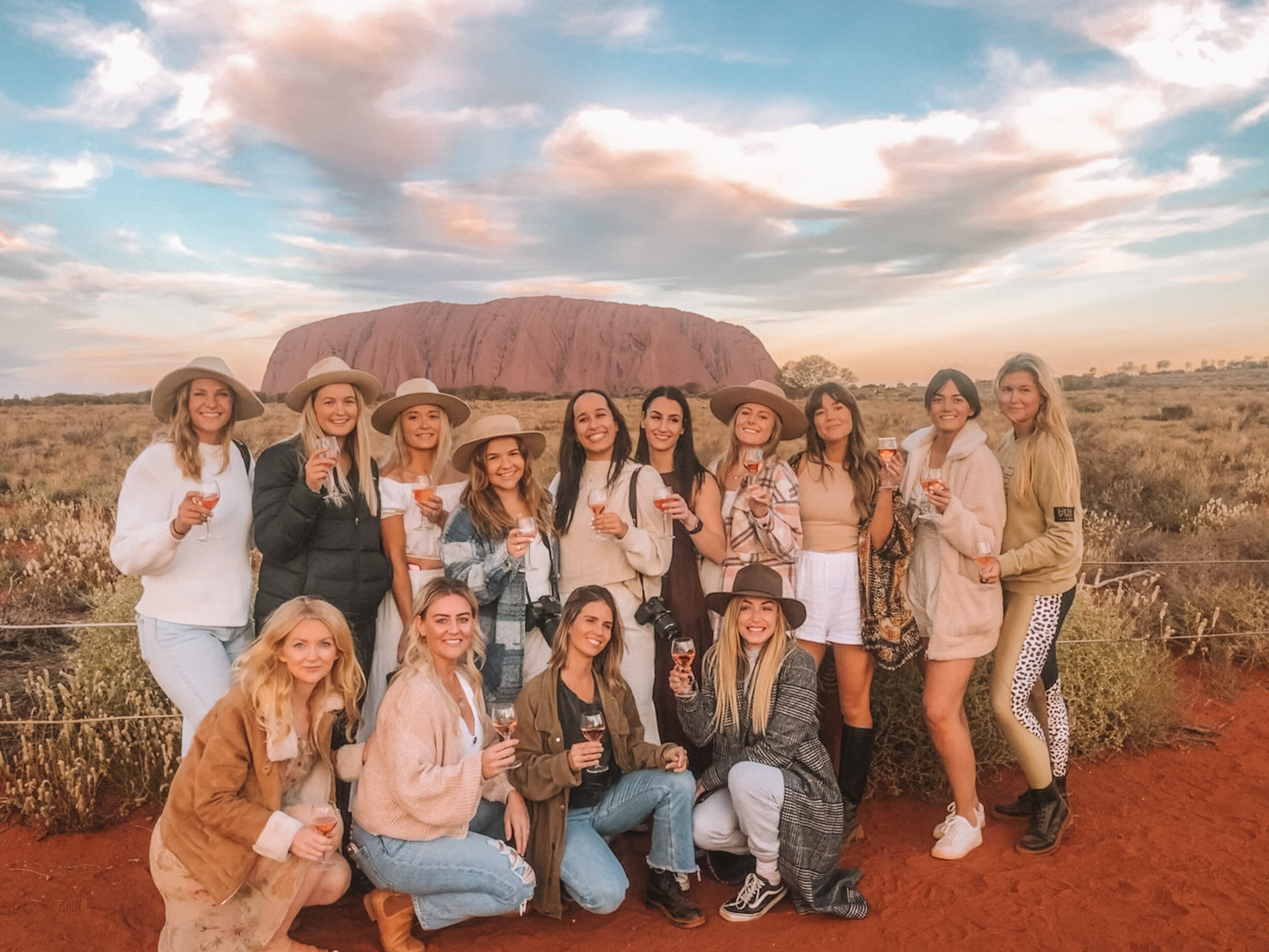 The girls posing with rosé at sunset - Uluru - Northern Territory - Australia
