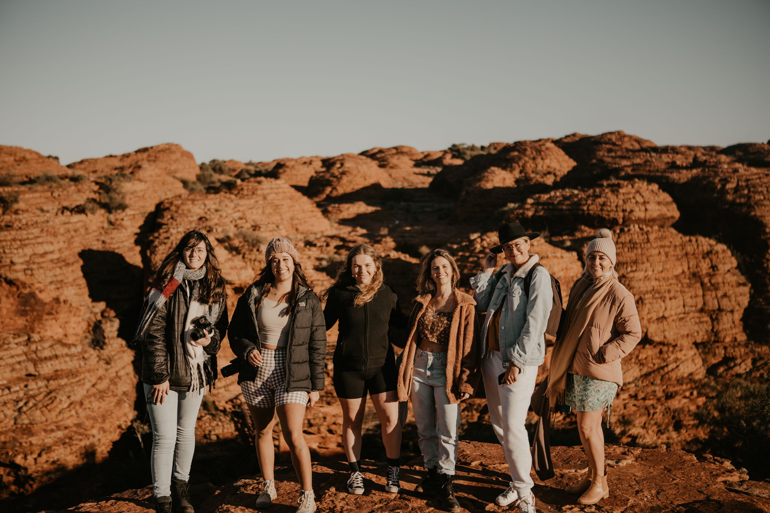 Six happy girls at sunrise - Kings Canyon - Petermann - Northern Territory - Australia