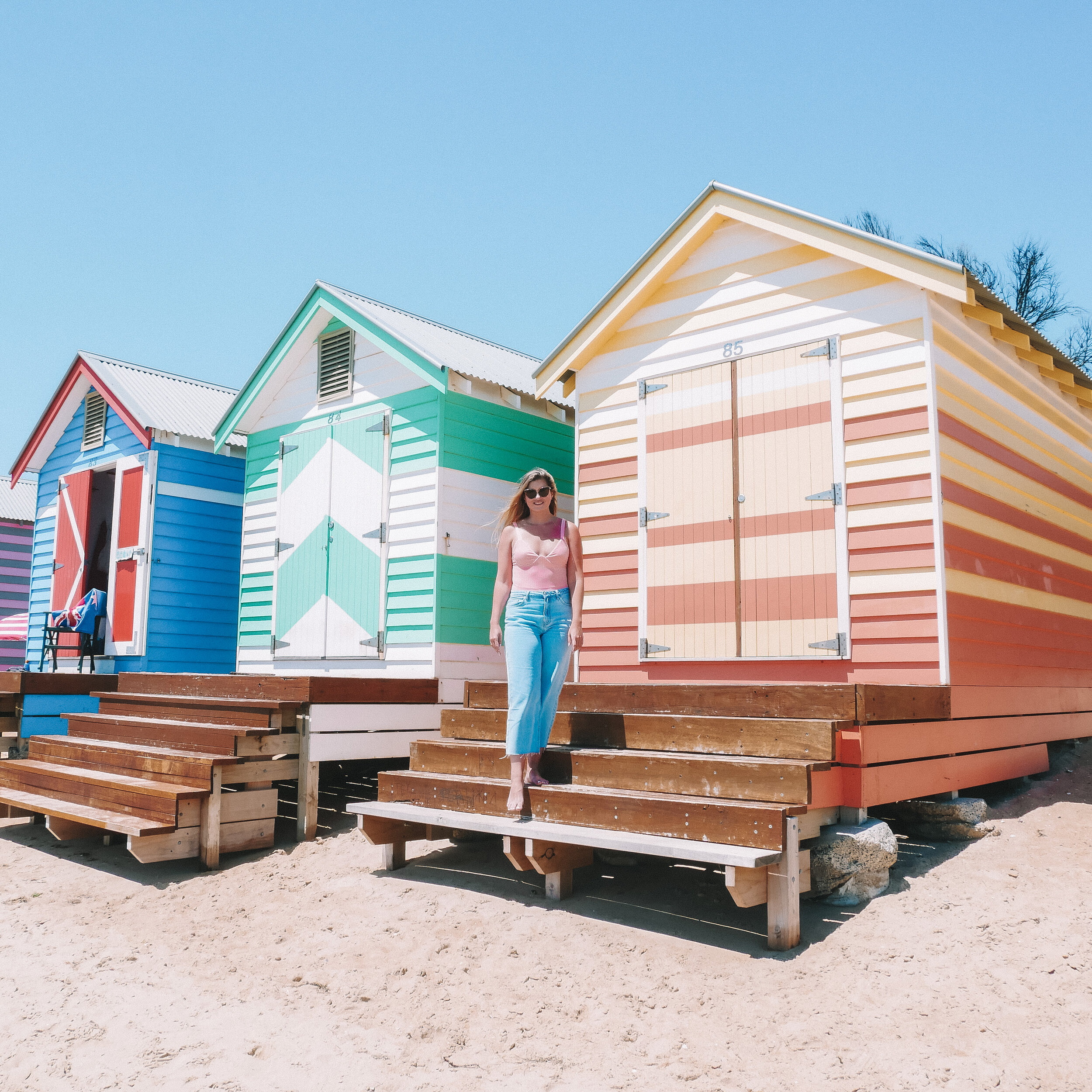 Posing in front of the colourful houses - Brighton Bathing Boxes - Brighton - Melbourne - Victoria - Australia