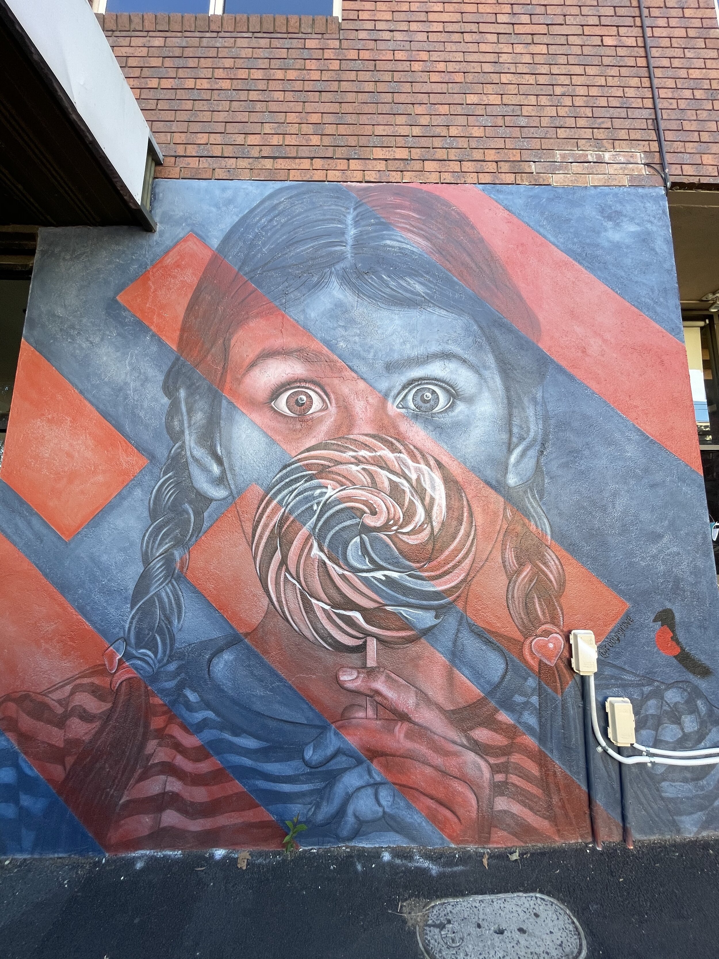 Girl eating candy graffiti - Melbourne - Victoria - Australia