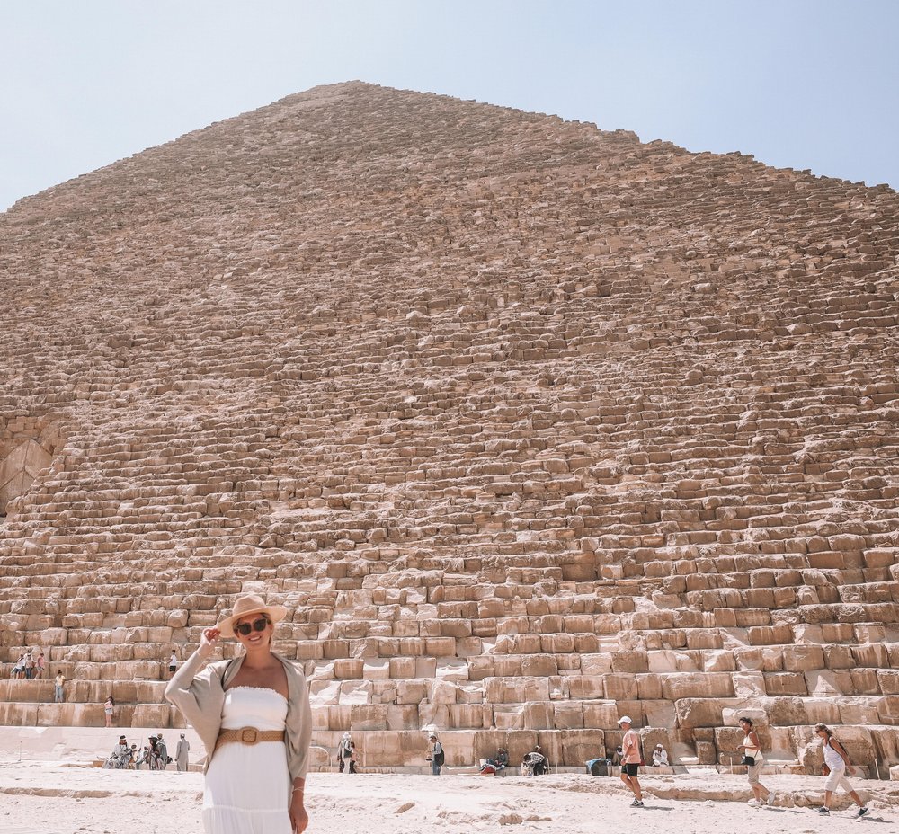 Posing in front of the Great Pyramid of Giza in the sun - Cairo - Egypt