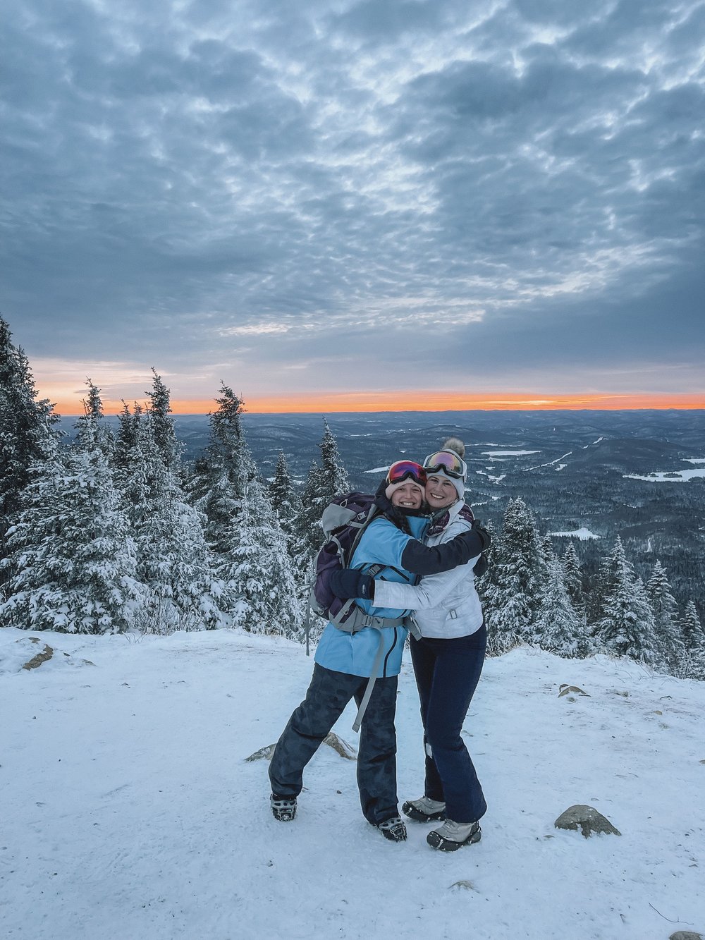 Two friends keeping warm on this winter hike - Mount Kaaikop - Laurentides - Quebec - Canada