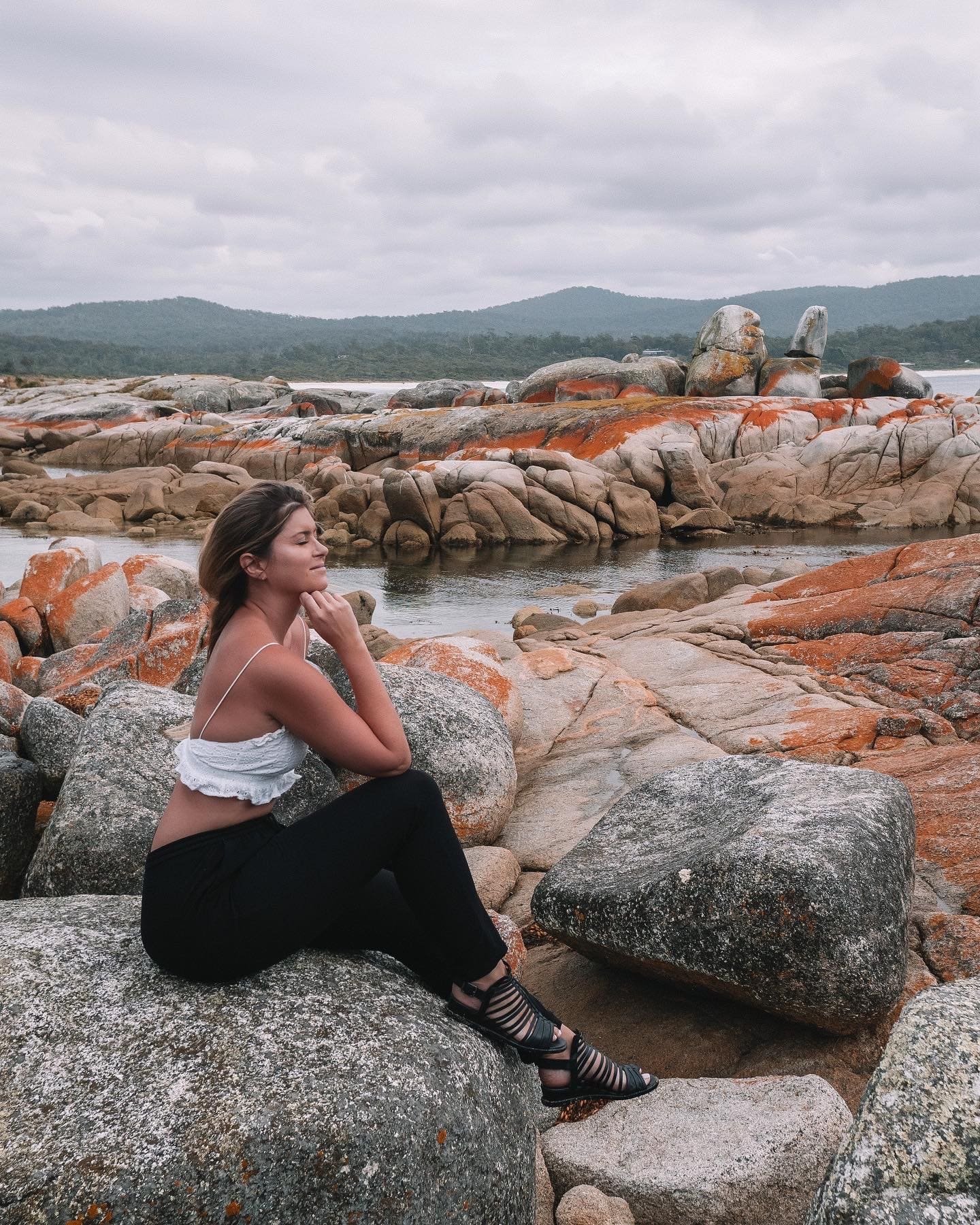 Posing peacefully on the orange rocks - Bay of Fires - Tasmania - Australia