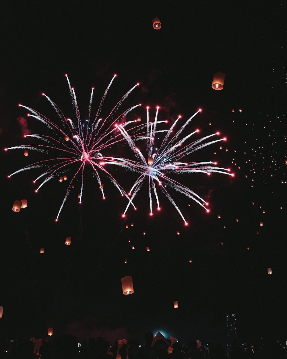 The fireworks and lanterns in the background - Yi Peng 2022 - CAD Cultural Center - Chiang Mai - Northern Thailand