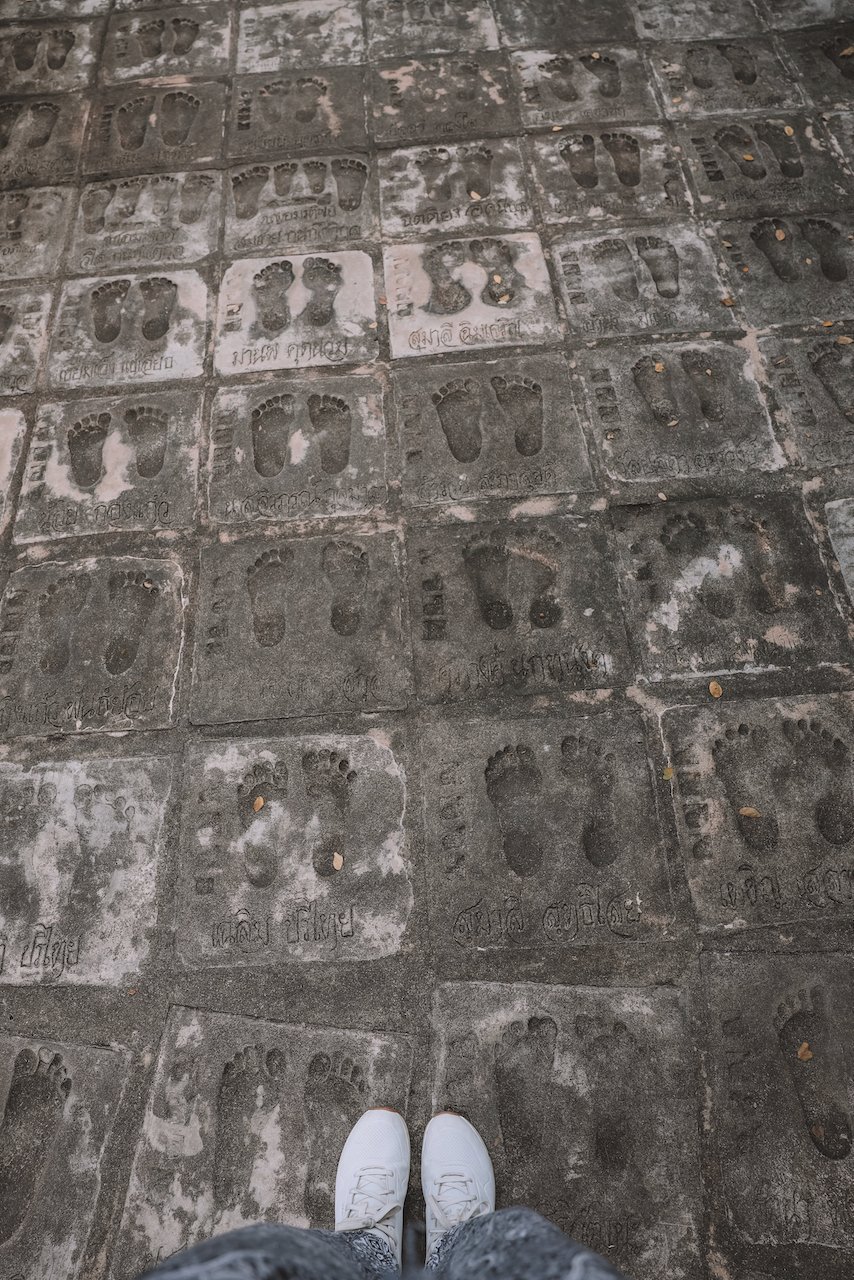 Monks Footsteps in the concrete pathway - Wat Samphran - Bangkok - Thailand